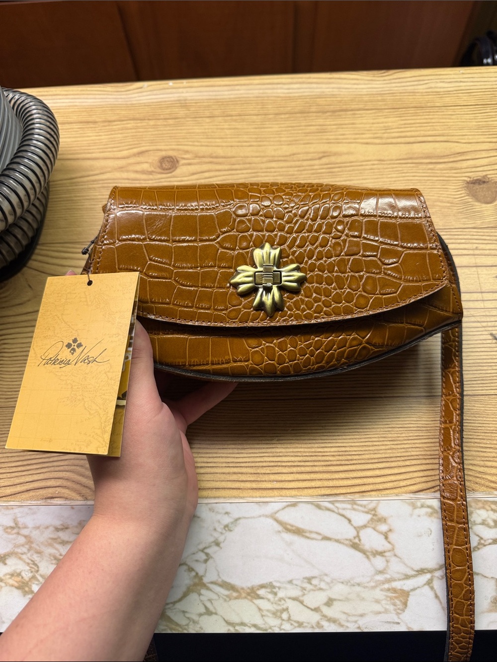 Patricia Nash Croc-Embossed Crossbody in Cognac Brown with Brass Flower Clasp